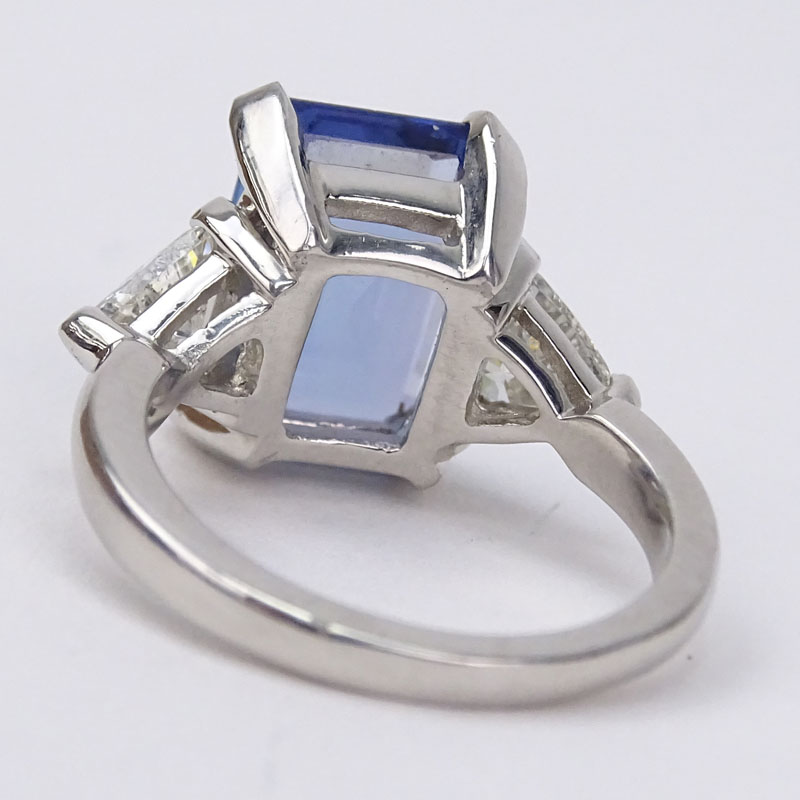 Approx. 5.50 Carat Emerald Cut Tanzanite, 1.15 Carat Trillion Cut Diamond and Platinum Engagement Ring. 