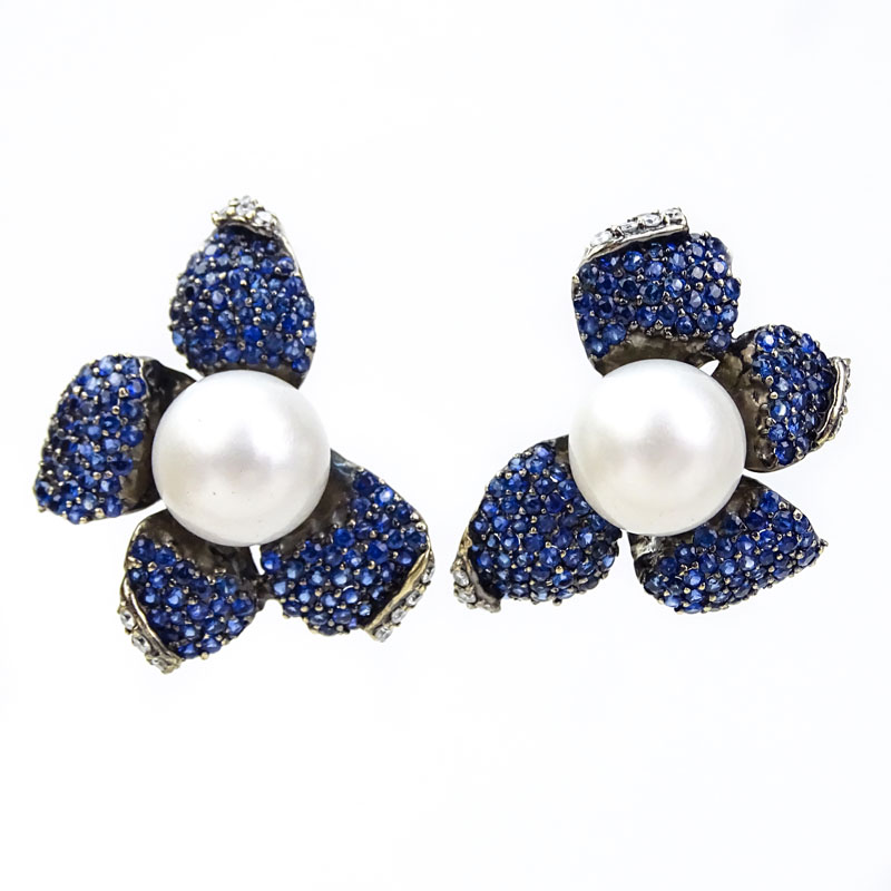 Approx. 9.23 Carat Pave Set Sapphire, .75 Carat Round Brilliant Cut Diamond, South Sea Pearl and 18 Karat White Gold Flower Earrings. 