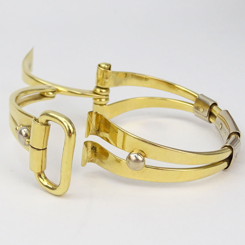 Amitai Kav, Israeli Circa 1995 Heavy 18 Karat Yellow and White Gold Modern Design Folding Horse Bit style Bracelet.