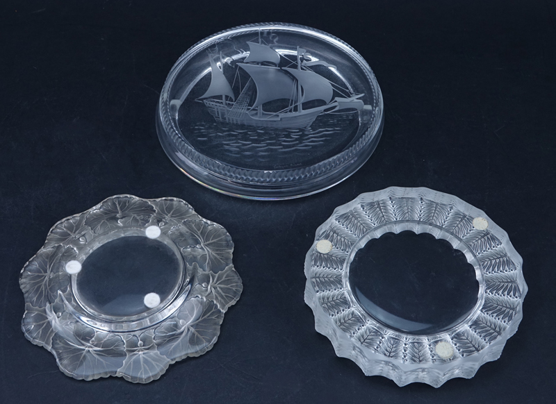Lot of Five (5) Lalique Crystal Tabletop Items. Includes: 2 pc "Jamaique" smoking set, "Duex Cygne" paperweight, "Hornfleur" ashtray, "Santa Maria" ashtray. 