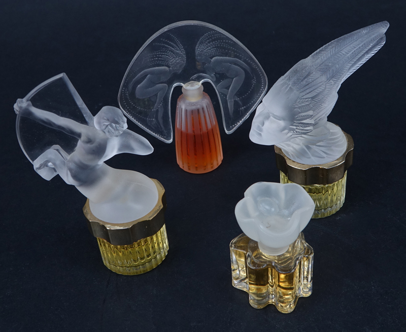 Seven (7) Miniature Lalique Bottles.