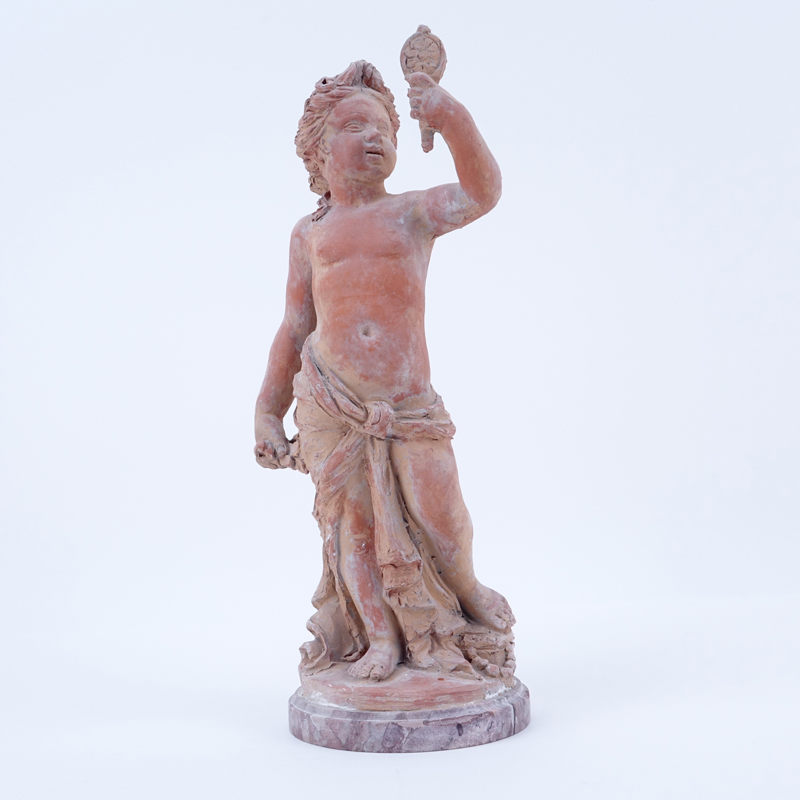 Antique Terra Cotta Figure Of A Putti On Marble Base.