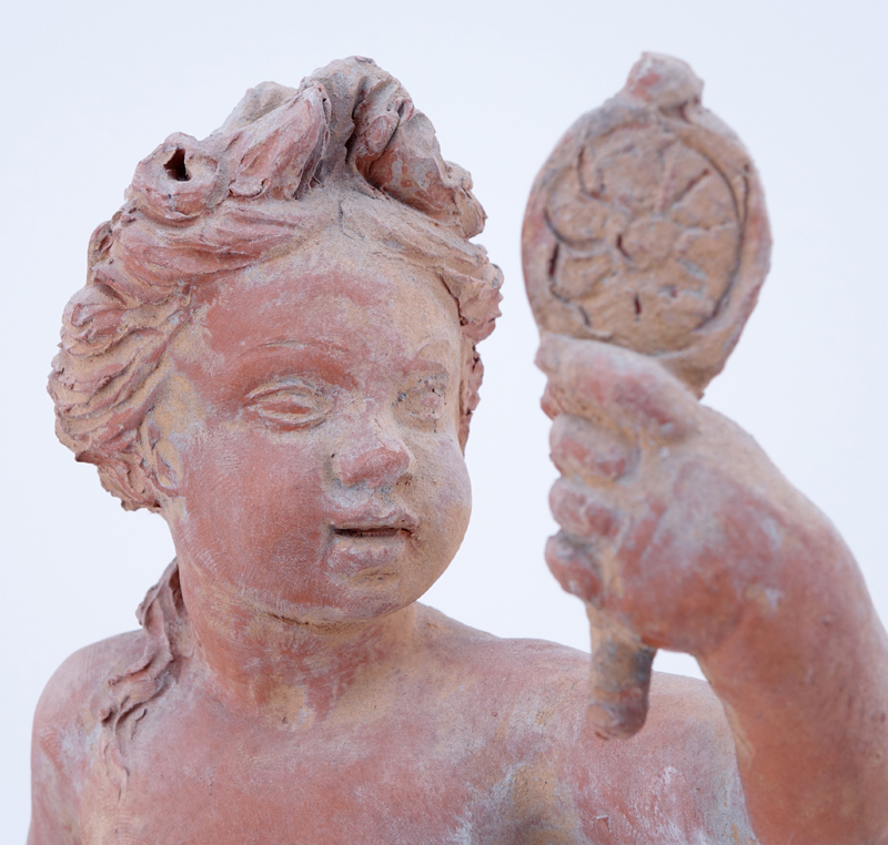 Antique Terra Cotta Figure Of A Putti On Marble Base.