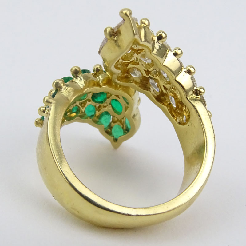 Vintage Approx. 3.0 Carat Oval Cut Emerald, 3.0 Carat Oval Cut Diamond and 18 Karat Yellow Gold Cross Over Ring. 