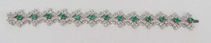 Approx. 2.33 Carat Pave Set Round Brilliant Cut Diamond, 2.20 Carat Round Brilliant Cut Emerald and 18 Karat White Gold Bracelet. 