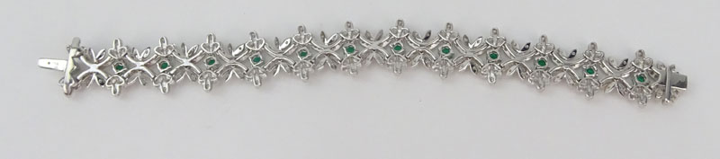 Approx. 2.33 Carat Pave Set Round Brilliant Cut Diamond, 2.20 Carat Round Brilliant Cut Emerald and 18 Karat White Gold Bracelet. 