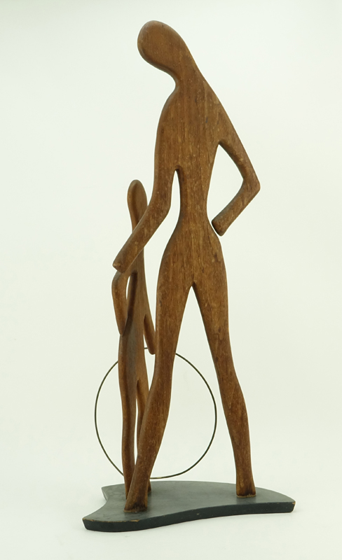 Val Robbins, American (1925-2009) Circa 1950's Carved walnut sculpture "Mother and Son With Hula Hoop". 