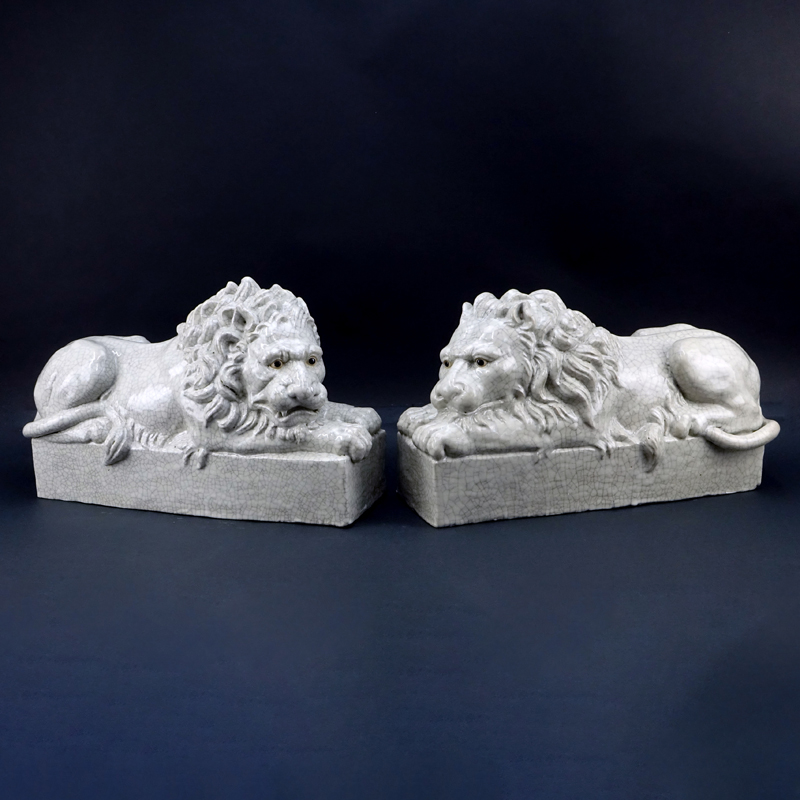 Pair of Large Glazed Pottery Resting Lions.
