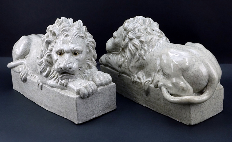 Pair of Large Glazed Pottery Resting Lions.