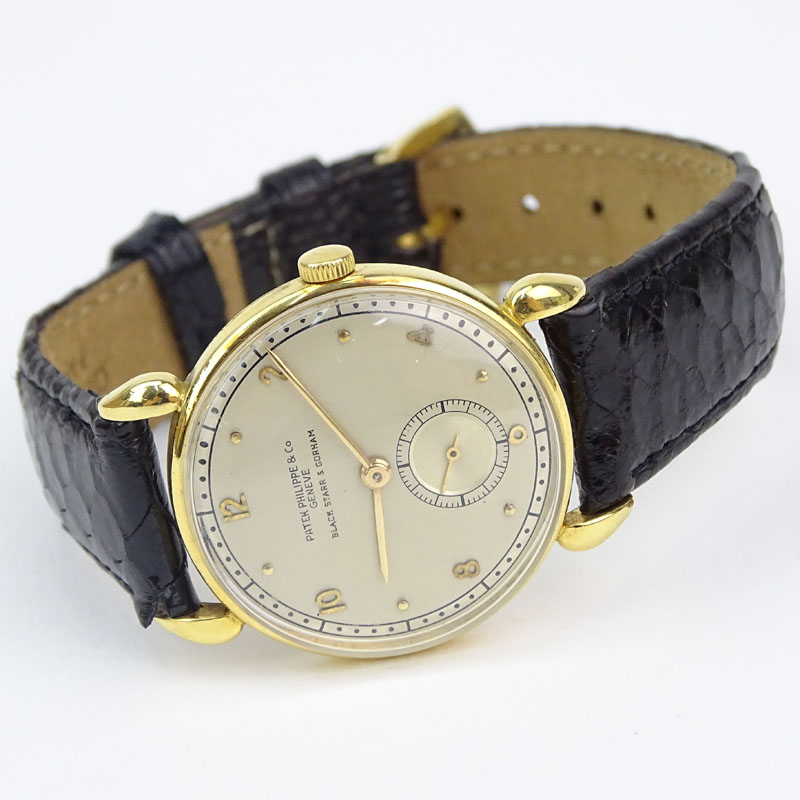 Vintage Patek Philippe for Black Starr & Gorham 18 Karat Yellow Gold Manual Movement Watch with Small Seconds Dial, Leather Strap and 18 Karat Yellow Gold Buckle. 