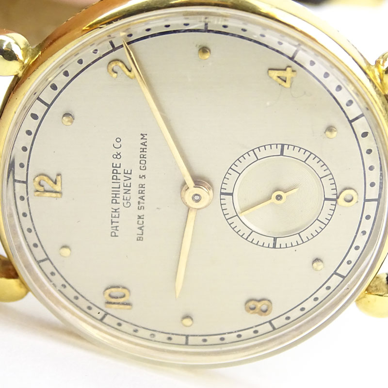 Vintage Patek Philippe for Black Starr & Gorham 18 Karat Yellow Gold Manual Movement Watch with Small Seconds Dial, Leather Strap and 18 Karat Yellow Gold Buckle. 