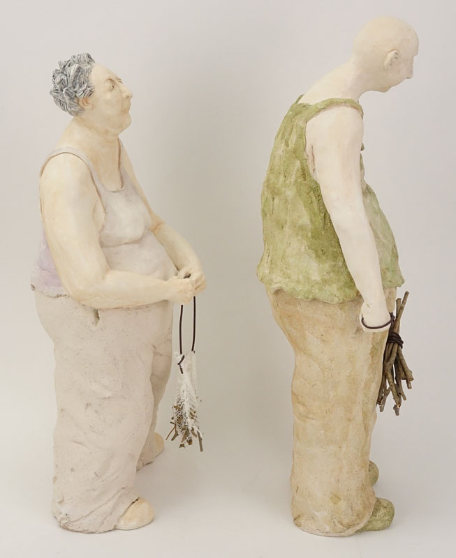 Two Contemporary Pottery Figures. Man And Woman With Sticks.
