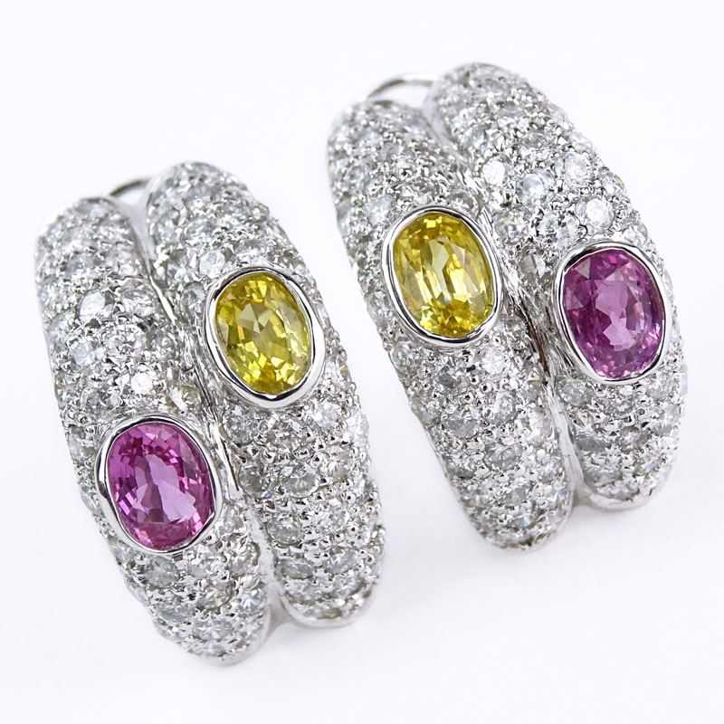 Approx. 4.22 Carat Pave Set Round Brilliant Cut Diamond, 1.74 Carat Oval Cut Pink Sapphire, 1.57 Carat Oval Cut Yellow Sapphire and 18 Karat White Gold Earrings. 