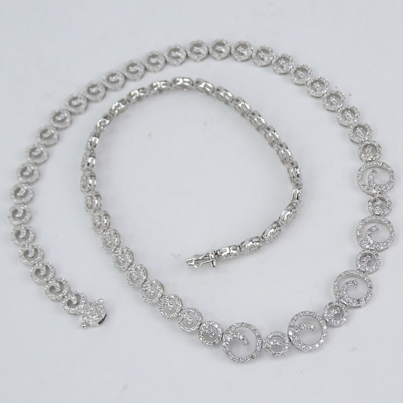 Approx. 1.0 Carat Micro Pave Set Round Brilliant Cut Diamond and 14 Karat White Gold Swirl Design Necklace.
