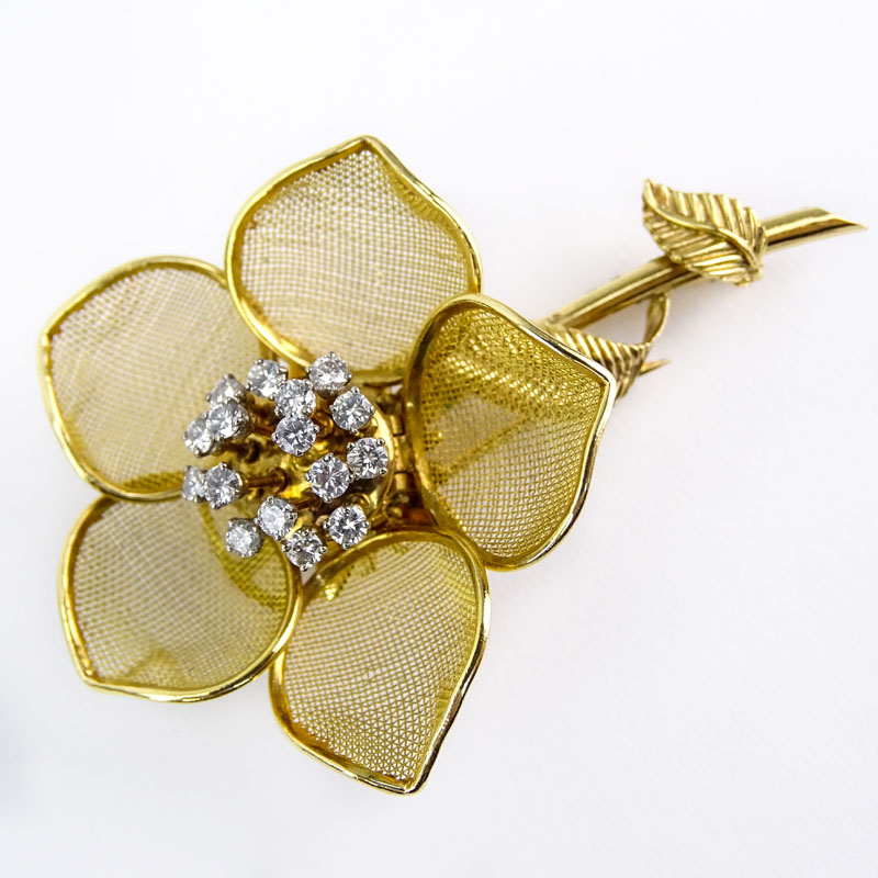 Retro Merrin France Approx. 1.25 Carat Round Brilliant Cut Diamond and 18 Karat Yellow Gold Articulated Flower Brooch.