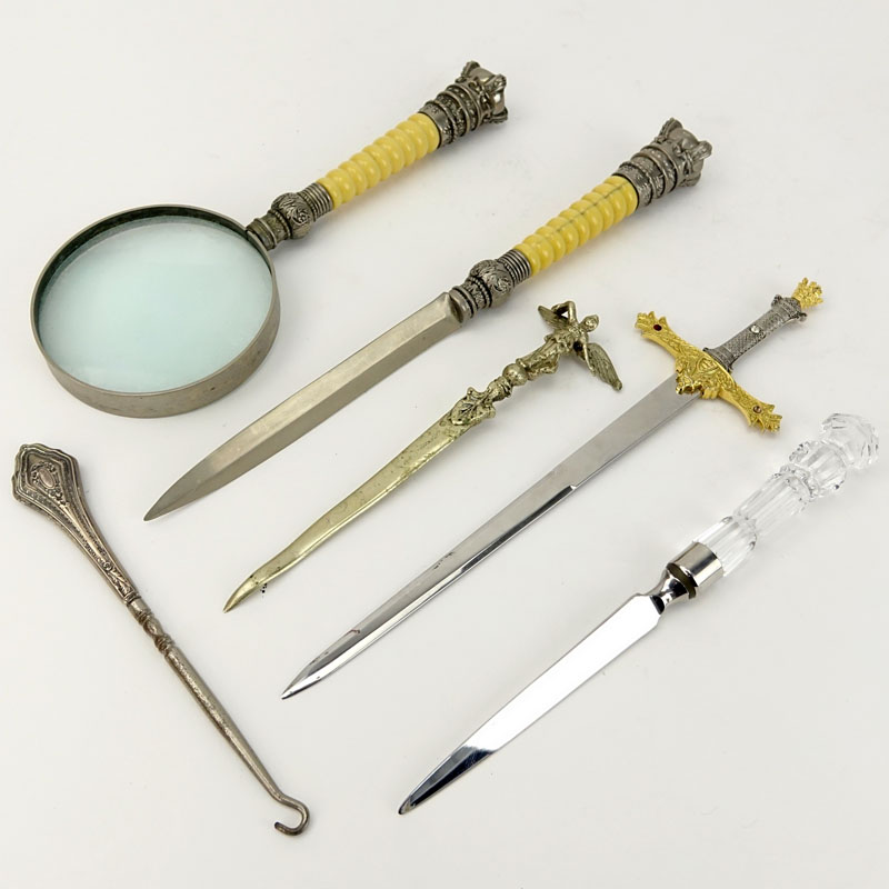 Grouping of Six (6) Assorted Items Comprising: four letter openers, magnifying lens, and a button hook. 