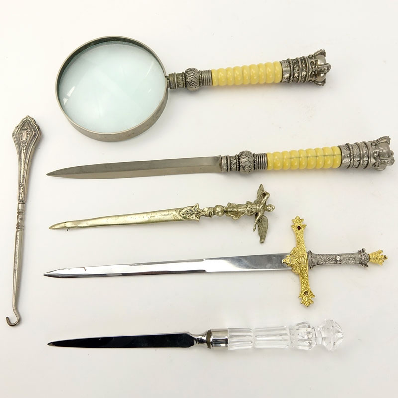 Grouping of Six (6) Assorted Items Comprising: four letter openers, magnifying lens, and a button hook. 