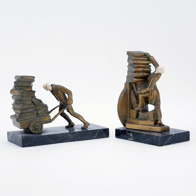 Pair of Gilt Metal Figural Bookends with Celluloid Faces.