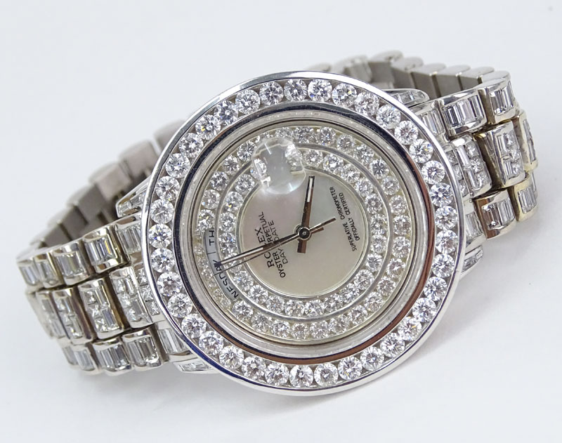 Man's Rolex 18 Karat White Gold Day Date Oyster Perpetual Set Throughout with Approx. 28.0 Carat Round Brilliant, Princess and Baguette Cut Diamonds. Diamonds D-F color, VVS-VS clarity. 
