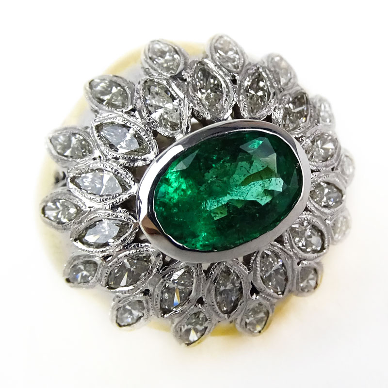 Vintage Oval Cut Emerald, Marquise Cut Diamond and 14 Karat Yellow and White Gold Ring. 