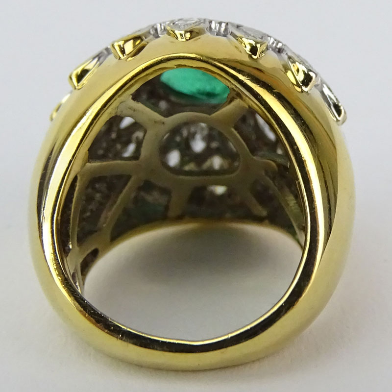 Vintage Oval Cut Emerald, Marquise Cut Diamond and 14 Karat Yellow and White Gold Ring. 