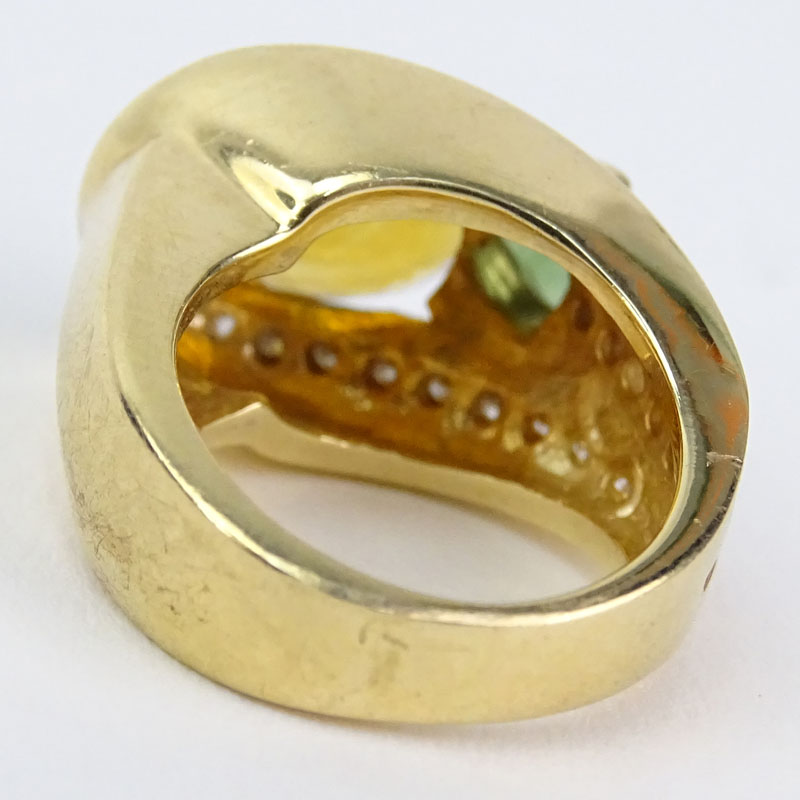 Vintage Oval Cut Citrine, Triangular Cut Green Tourmaline, Diamond and 14 Karat Yellow Gold Ring. 