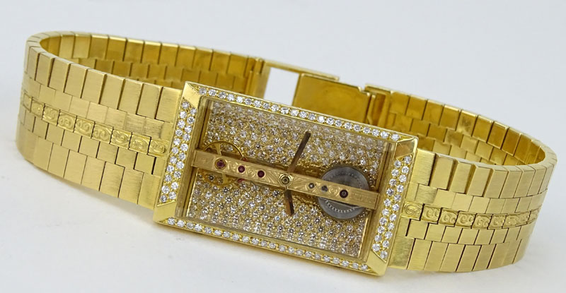 Man's Vintage Corum 1484 Pave Set Diamond and 18 Karat Yellow Gold Bridge Skeleton Bracelet Watch with Automatic Movement.