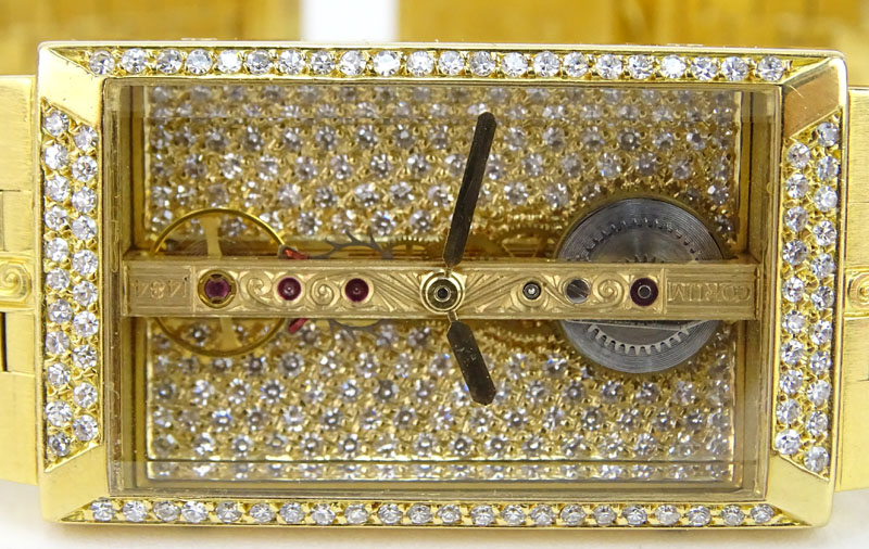 Man's Vintage Corum 1484 Pave Set Diamond and 18 Karat Yellow Gold Bridge Skeleton Bracelet Watch with Automatic Movement.
