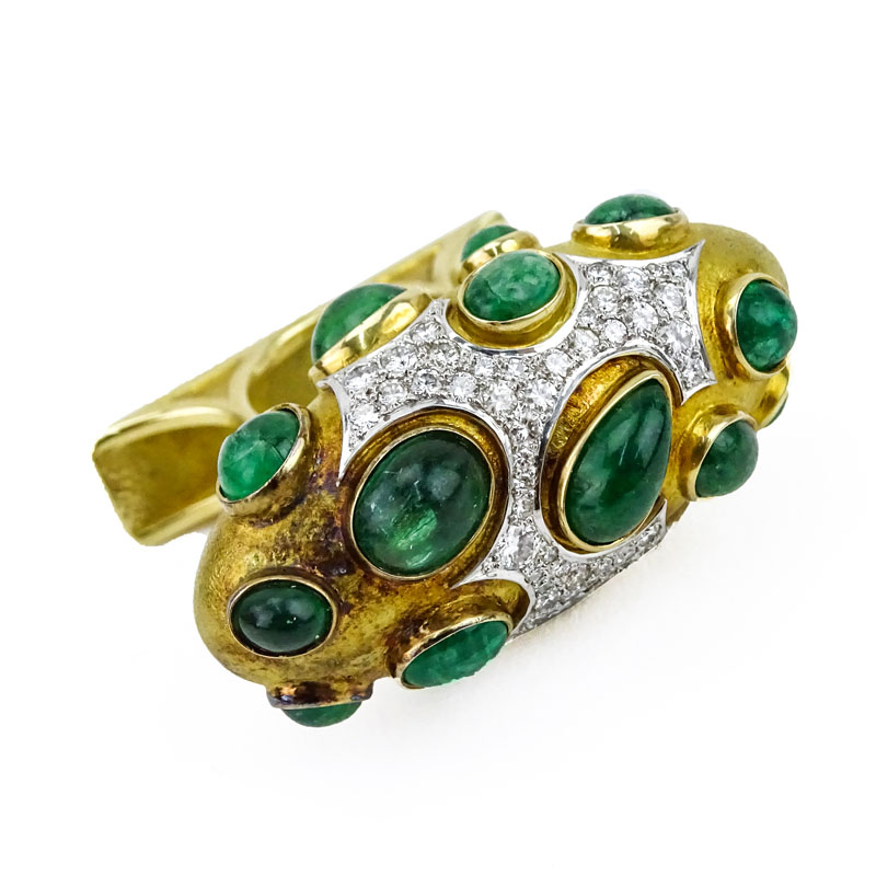 Circa 1968 Roger Lucas (20th century) Montreal, Canada Approx. 16.0-18.0 Carat Sixteen (16) Cabochon Colombian Emerald, 5.5-6.0 Carat Pave Set Diamond and Heavy 18 Karat Yellow Gold Three Finger Ring. 
