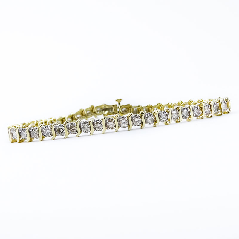 Vintage Approx. 5.0 Carat Round Brilliant Cut Diamond and 14 Karat Yellow Gold Tennis Bracelet.