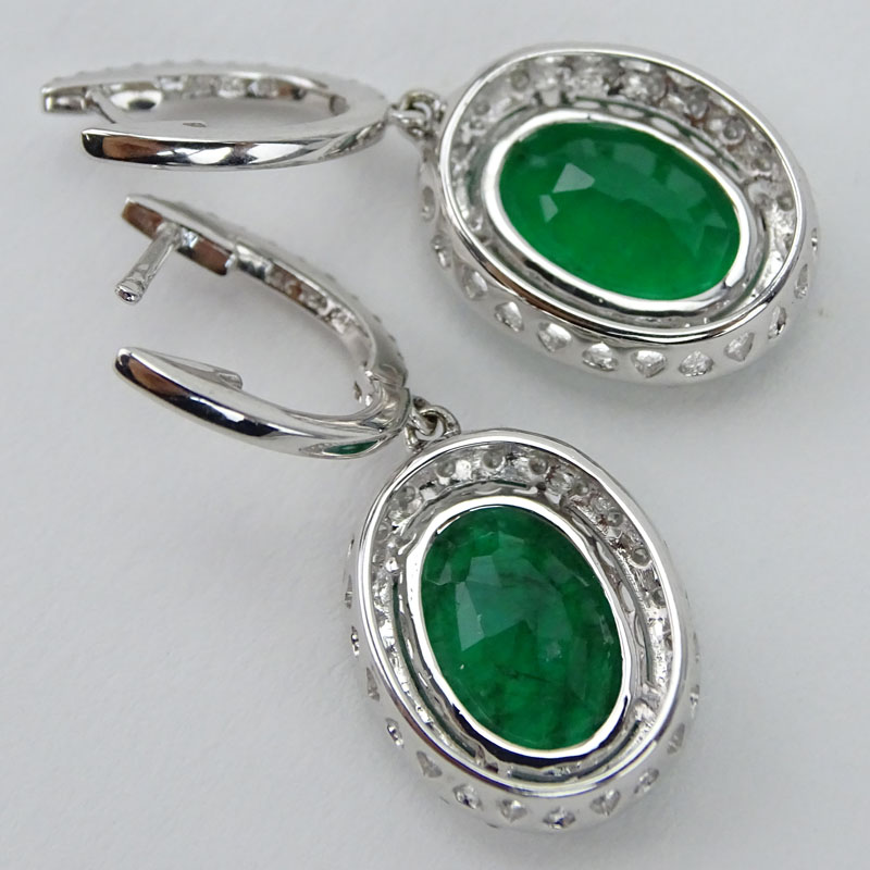Approx. 5.45 Carat Oval Cut Emerald, 1.15 Carat Diamond and 18 Karat White Gold Pendant Earrings. 