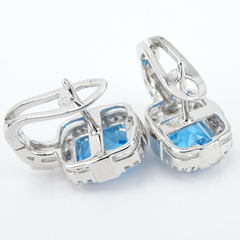 Approx. 4.38 Carat Emerald Cut London Blue Topaz, .45 Carat Diamond and 18 Karat White Gold Earrings.