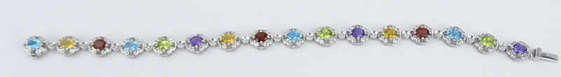 Approx. 5.40 Carat Oval Cut Multi Stone, .73 Carat Round Cut Diamond and 18 Karat White Gold Bracelet. 