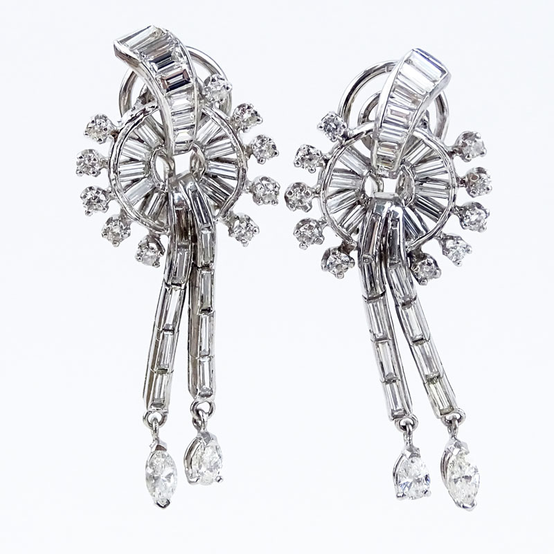 Circa 1940s Approx. 4.0 Carat Baguette and Round Brilliant Cut Diamond and Platinum Earrings.