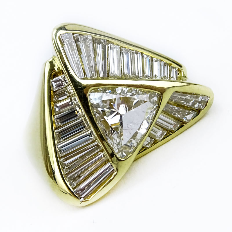 Approx. 5.45 Carat TW Trillion and Tapered Baguette Cut Diamond and 18 Karat Yellow Gold Ring.