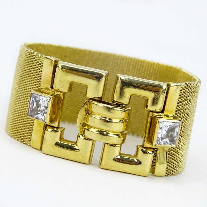 Retro Circa 1960s Italian 14 Karat Yellow Gold Wide Bracelet Set with Two (2) Princess Cut CZ. Stamped Italy 14K and maker's mark.