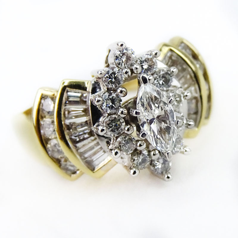 Approx. 1.75 Carat TW Marquise, Round Brilliant and Baguette Cut Diamond and 14 Karat yellow Gold Engagement Ring. 