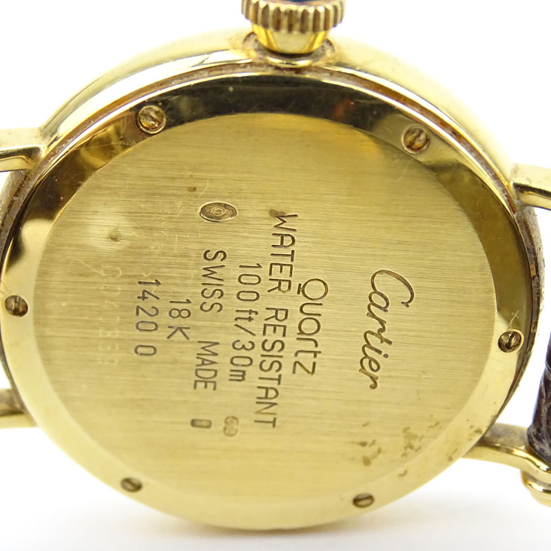 Vintage Cartier 18 Karat Yellow Gold Watch with Swiss Quartz Movement, Leather Strap and 18 Karat Yellow Gold Deployment Buckle. 