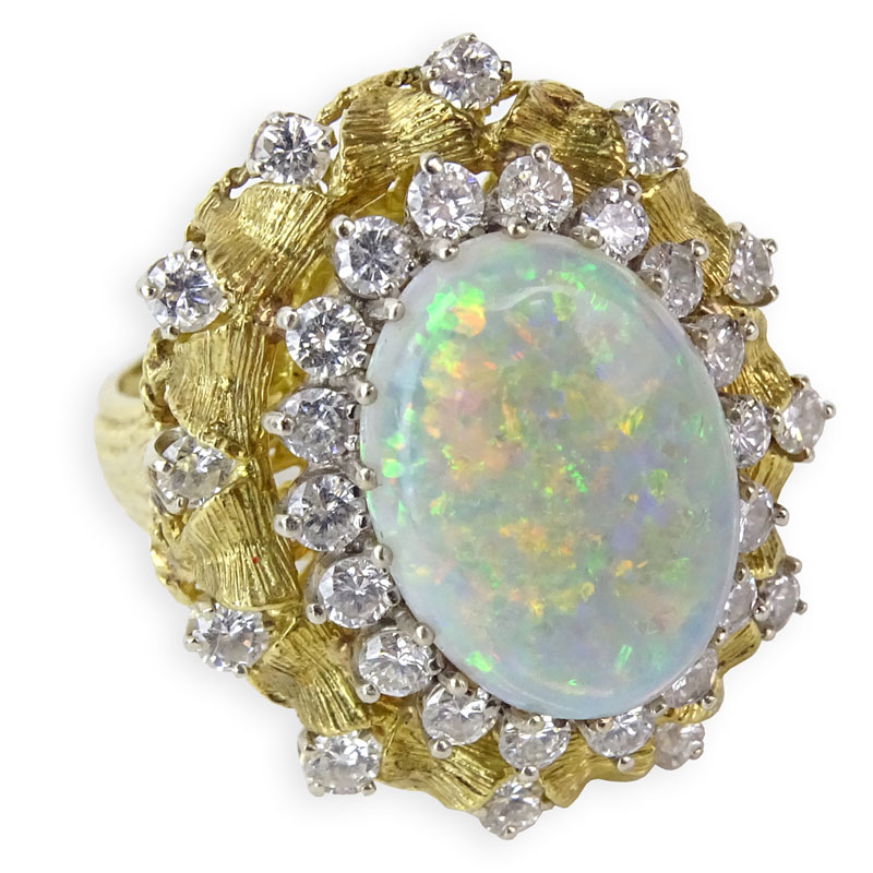 Vintage Approx. 5.20 Carat Oval Cabochon Opal, 1.75 Carat Round Brilliant Cut Diamond and 18 Karat Yellow Gold Ring.