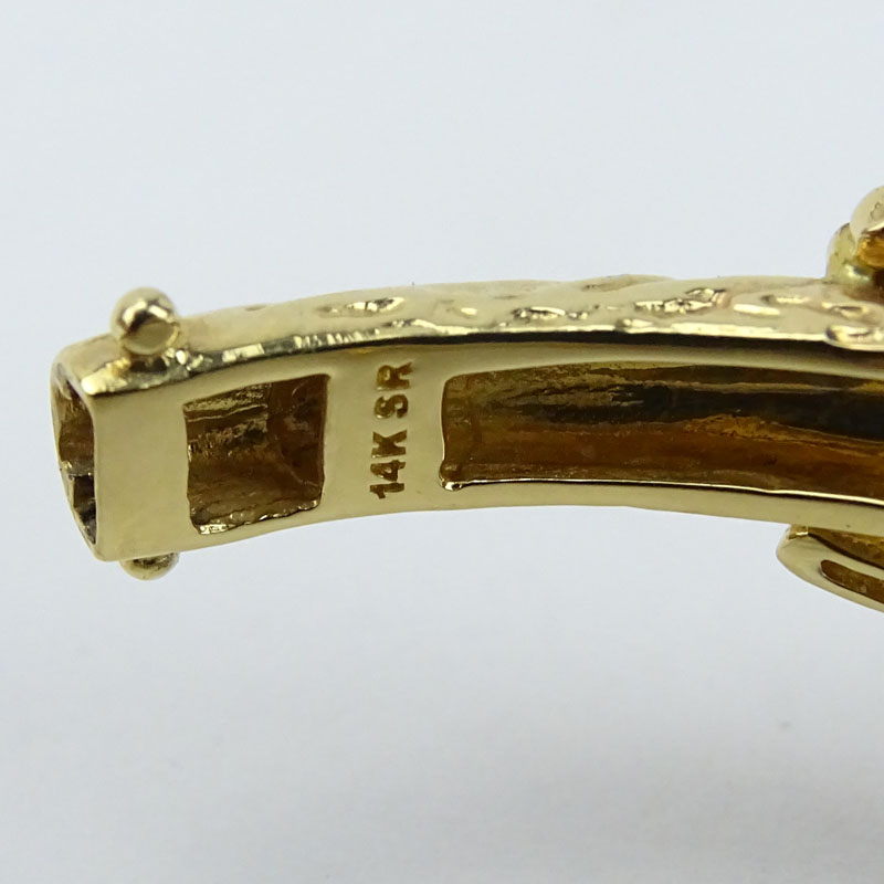Approx. 13.0 Carat Pave Set Burma Ruby and 14 Karat Yellow Gold Panther Hinged Bangle Bracelet.