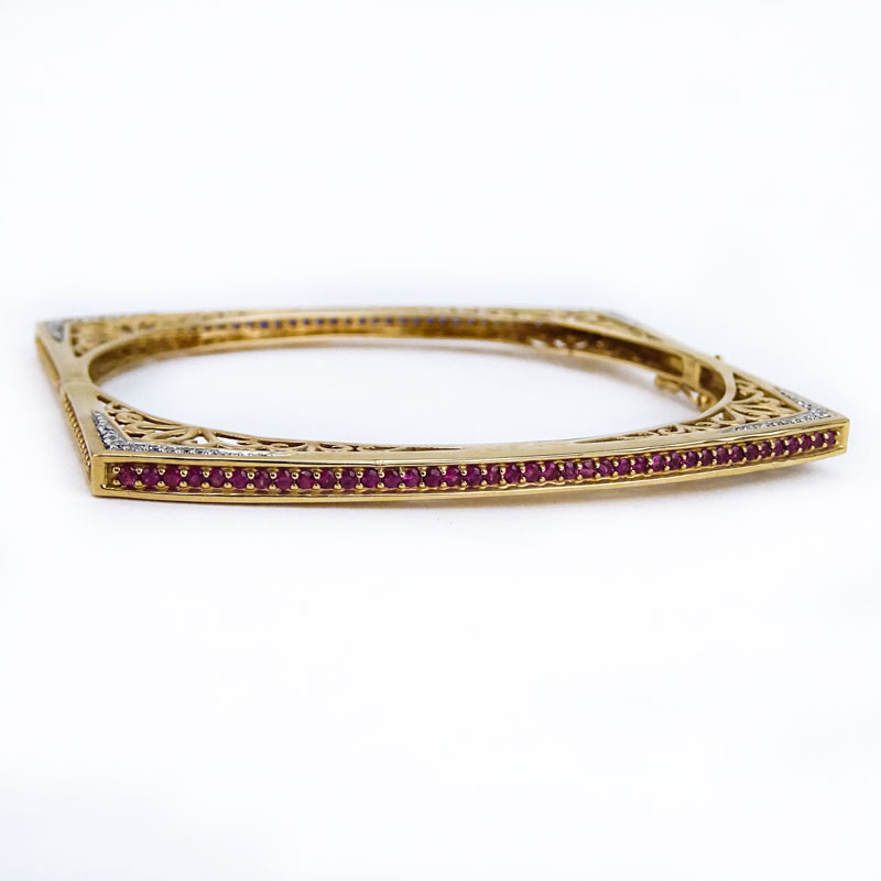 Fine 14 Karat Yellow Gold, Diamond, Round Cut Sapphire and Ruby Openwork Square Form Hinged Bangle Bracelet.