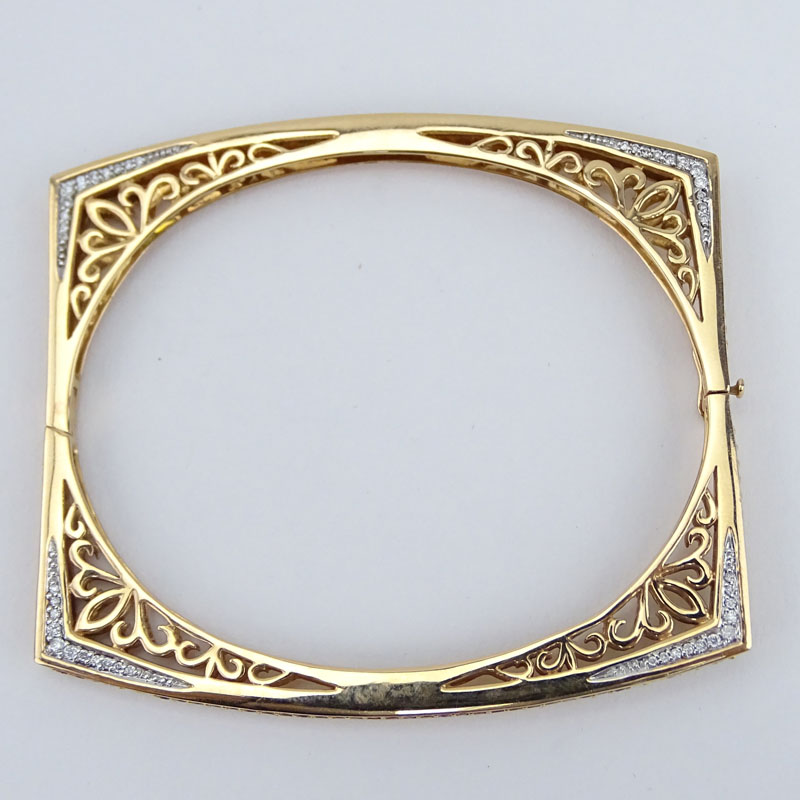 Fine 14 Karat Yellow Gold, Diamond, Round Cut Sapphire and Ruby Openwork Square Form Hinged Bangle Bracelet.