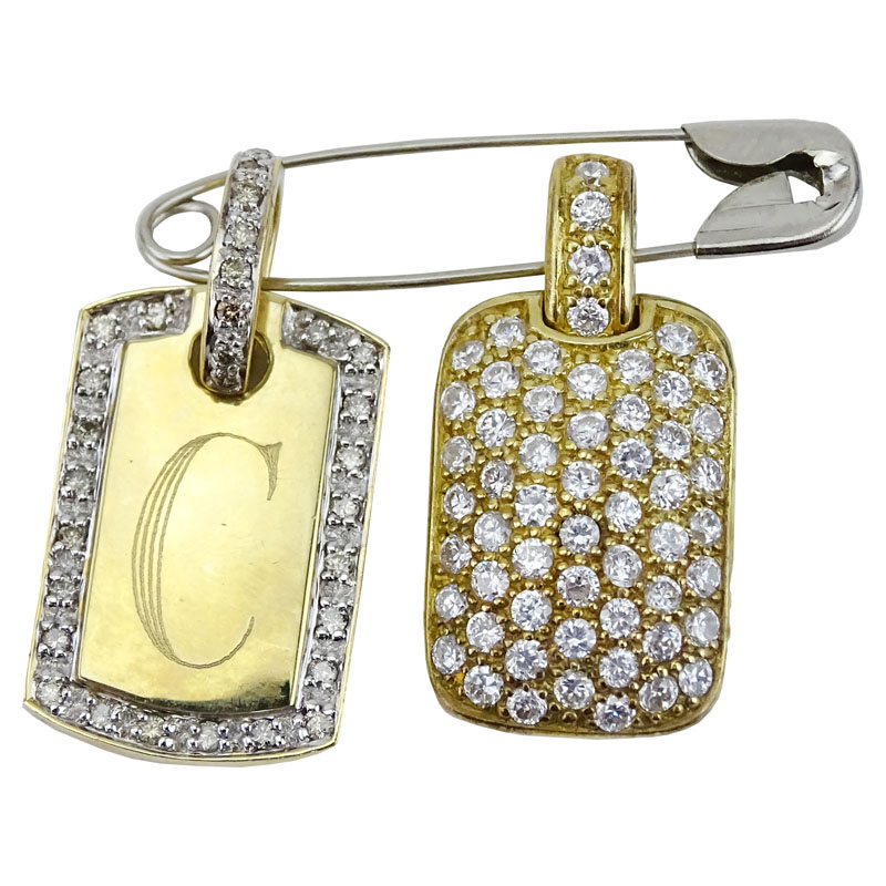 Vintage 14 Karat Yellow Gold and Diamond Pendant along with Sterling and CZ Pendant.