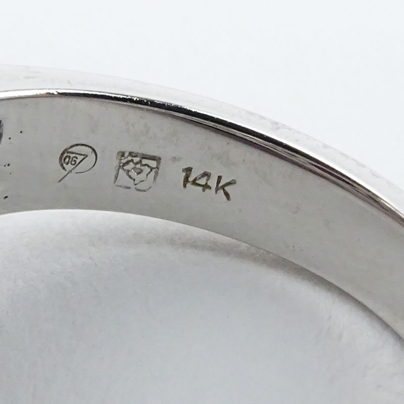 Large Oval Cushion Cut Rubelite Tourmaline, Pave Set Diamond and 14 Karat White Gold Ring.