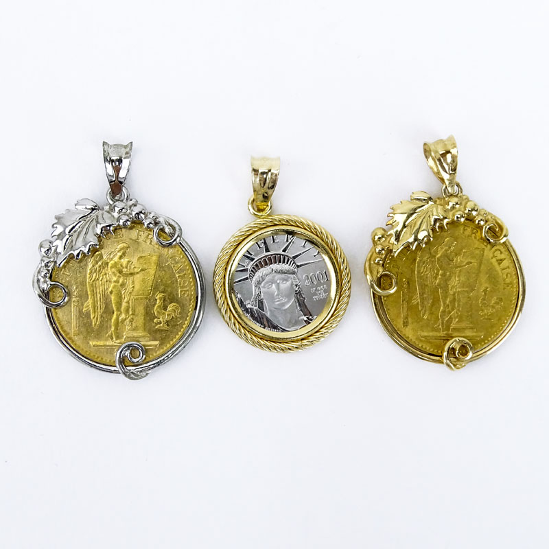 Vintage Platinum American Eagle $10 Coin along with two (2) 1876 Gold Lucky Angel 20 Franc Coins all in White or Yellow 14 Karat Gold Pendants.