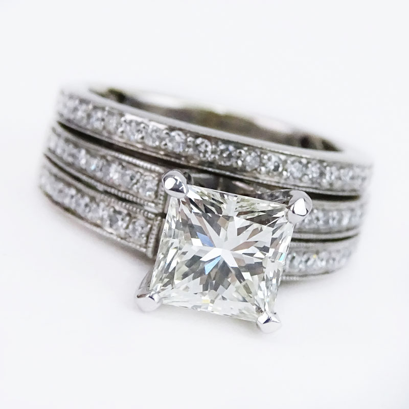 EGL Certified 2.01 Carat Princess Cut Diamond and 14 Karat White Gold Engagement Ring accented throughout with approx. .60 Carat Round Brilliant Cut Diamonds.