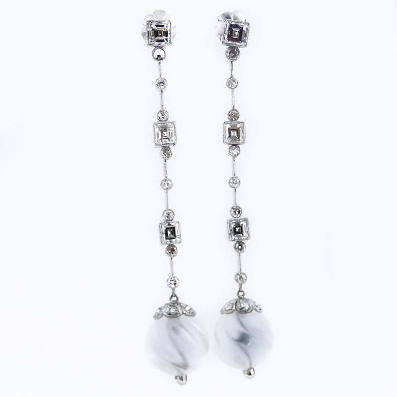 Approx. 3.30 Carat Square Emerald Cut Diamond, 1.0 Carat Round Cut Diamond, Carved Rock Crystal and Platinum Chandelier Earrings.