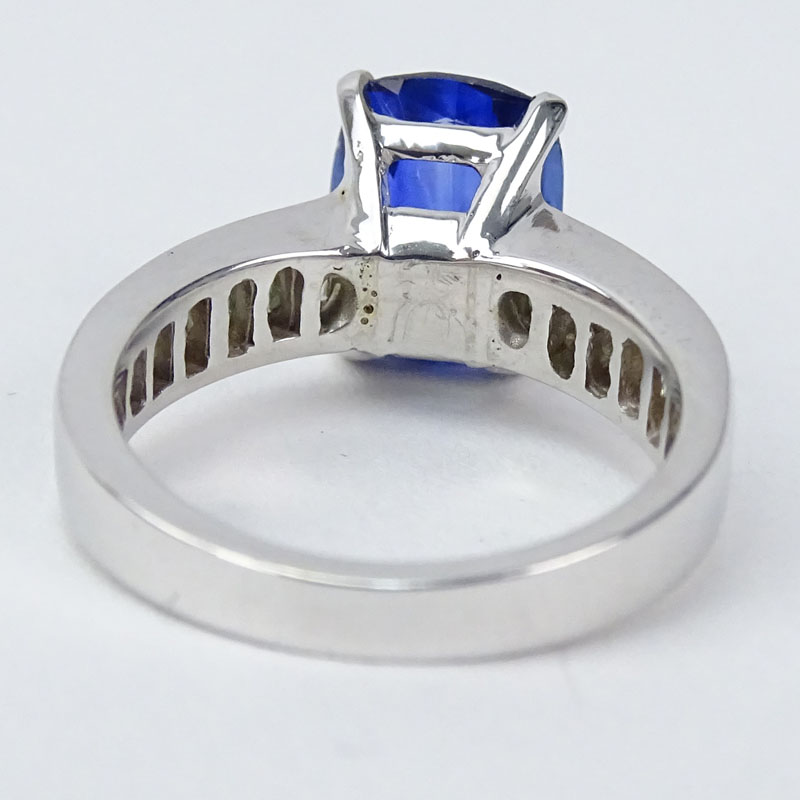 Approx. 3.47 Carat Cushion Cut Sapphire, .75 Carat Baguette Cut Diamond and 18 Karat White Gold Ring. 