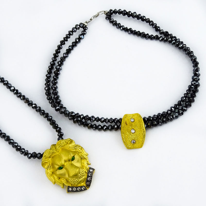 Vintage Black Diamond Bead Necklace(s) and Double Strand Bracelet Suite, the Necklace with 24 Karat Fine Gold Figural Lion Pendant accented with Fancy Yellow Diamonds and Emerald Eyes, the Bracelet with 24 Karat Yellow Gold and Diamond Charm.