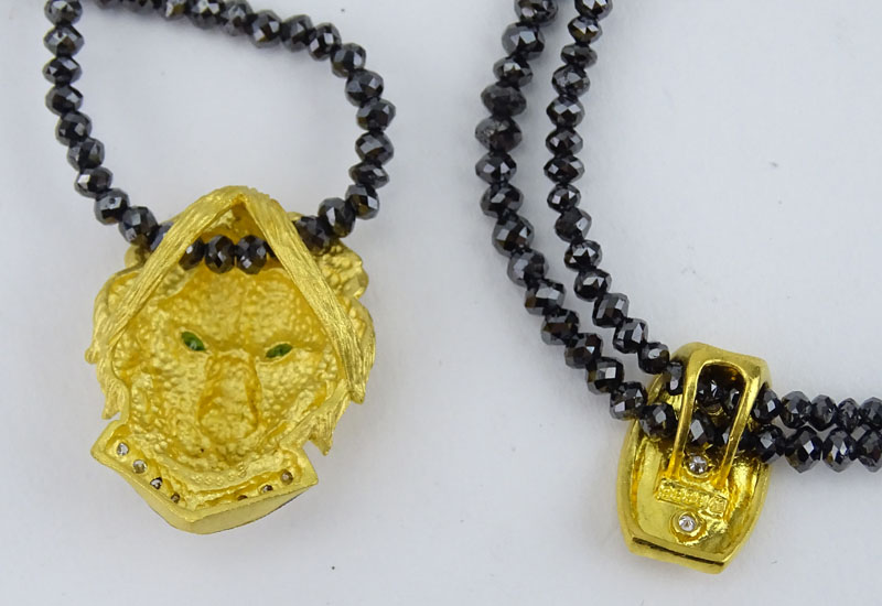 Vintage Black Diamond Bead Necklace(s) and Double Strand Bracelet Suite, the Necklace with 24 Karat Fine Gold Figural Lion Pendant accented with Fancy Yellow Diamonds and Emerald Eyes, the Bracelet with 24 Karat Yellow Gold and Diamond Charm.